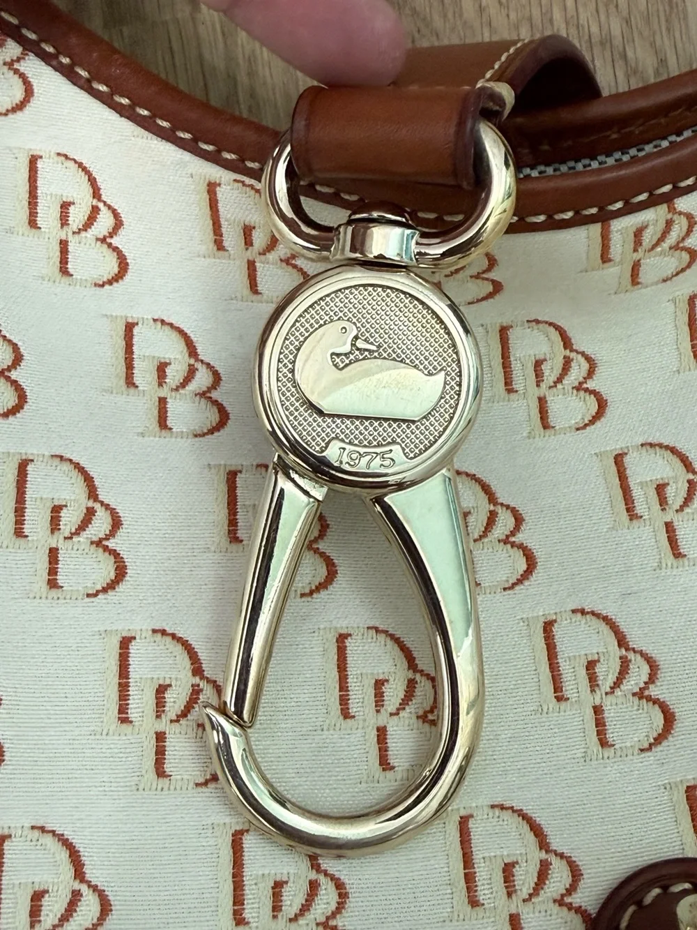 Dooney & Bourke Cream/Brown Signature Logo Lock Canvas Hobo Shoulder Bag